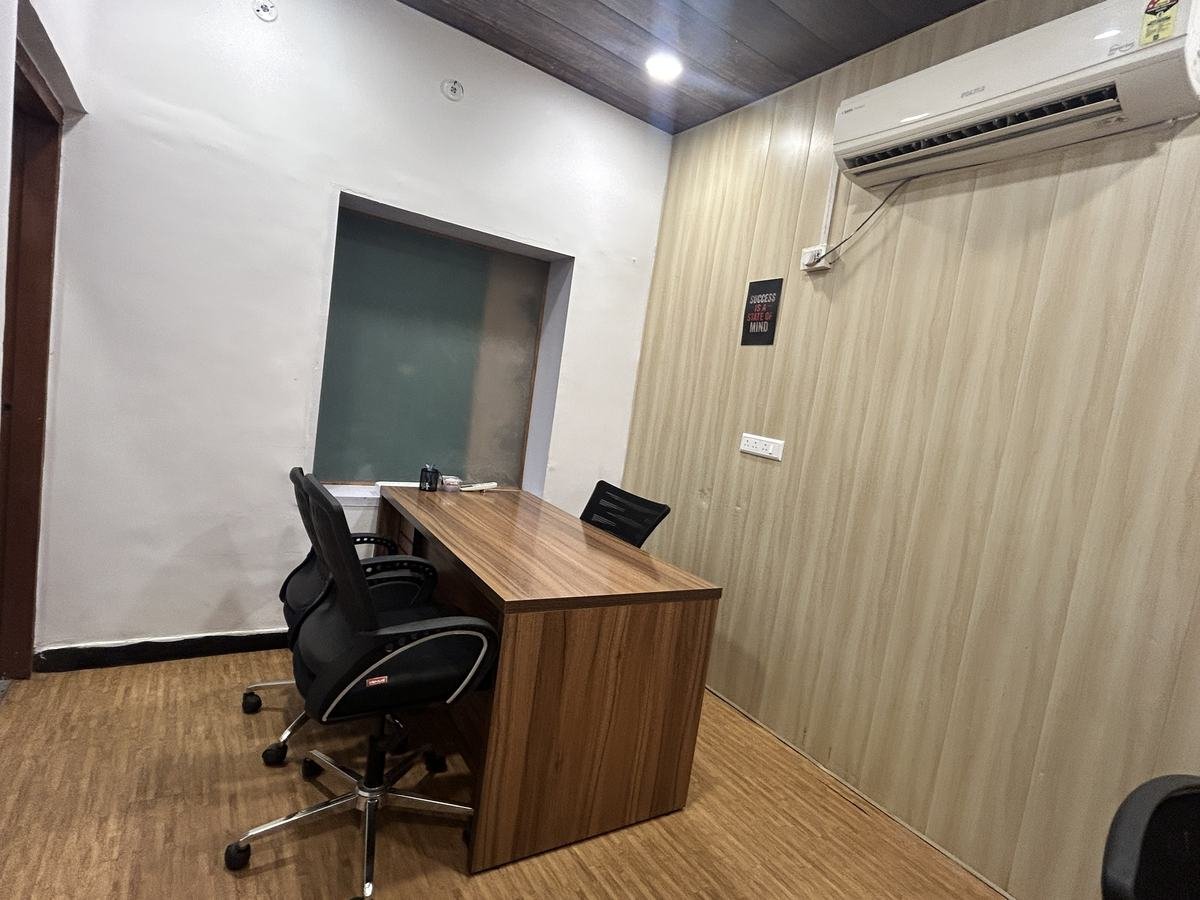 Private cabin with desk and ergonomic chair