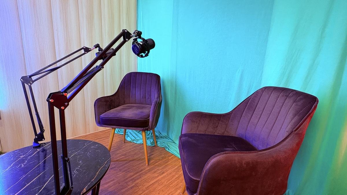 Podcast studio with chairs, microphones and lighting